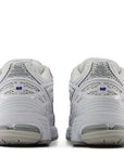 New Balance Women's 1906R in White with Team Royal and Silver Metallic